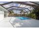 Inviting pool with screened enclosure at 193 Beeney Se Rd, Port Charlotte, FL 33952