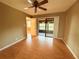 Bedroom with access to balcony and wood-look floors at 19505 Quesada Ave # Rr203, Port Charlotte, FL 33948