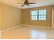 Bedroom with tile floors and a window with blinds at 19505 Quesada Ave # Rr203, Port Charlotte, FL 33948