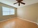 Bright bedroom with ceiling fan and window blinds at 19505 Quesada Ave # Rr203, Port Charlotte, FL 33948