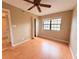 Spacious bedroom with ceiling fan and large window at 19505 Quesada Ave # Rr203, Port Charlotte, FL 33948