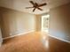 Bright bedroom with ceiling fan and wood-look flooring at 19505 Quesada Ave # Rr203, Port Charlotte, FL 33948