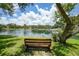 Serene community lake with a fountain and benches at 19505 Quesada Ave # Rr203, Port Charlotte, FL 33948