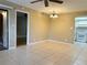 Dining area with tile floors and access to living room at 19505 Quesada Ave # Rr203, Port Charlotte, FL 33948