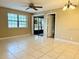 Bright living room with tile floors and sliding doors at 19505 Quesada Ave # Rr203, Port Charlotte, FL 33948