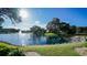 Serene pond with fountain, landscaped areas, and building views at 19505 Quesada Ave # Rr203, Port Charlotte, FL 33948