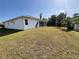 Spacious backyard with grassy area at 2057 Wonderwin St, Port Charlotte, FL 33948