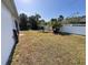 Large backyard with grassy area and privacy fence at 2057 Wonderwin St, Port Charlotte, FL 33948