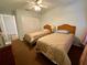 Bedroom with two twin beds and ceiling fan at 2057 Wonderwin St, Port Charlotte, FL 33948