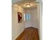 Bright entryway with hardwood floors and a view of the interior at 2057 Wonderwin St, Port Charlotte, FL 33948