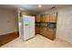 Kitchen with wood cabinets, built-in microwave, and a large refrigerator at 2057 Wonderwin St, Port Charlotte, FL 33948