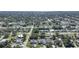 Aerial view of neighborhood with houses and trees at 21241 Winside Ave, Port Charlotte, FL 33952