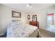 Cozy bedroom, complete with a ceiling fan and wood dresser at 21241 Winside Ave, Port Charlotte, FL 33952