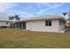 House exterior showcasing backyard and screened patio at 2171 Bayou Rd, Punta Gorda, FL 33950