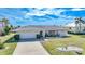 Single-story home with attached garage and landscaped yard at 2171 Bayou Rd, Punta Gorda, FL 33950