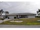 Single-story home with attached garage and landscaped yard at 2171 Bayou Rd, Punta Gorda, FL 33950