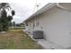 House side view with AC unit at 2171 Bayou Rd, Punta Gorda, FL 33950