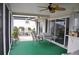 Screened patio with table, chairs, and ceiling fan at 2171 Bayou Rd, Punta Gorda, FL 33950