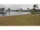 Canal-front property with boat and neighboring homes at 2171 Bayou Rd, Punta Gorda, FL 33950