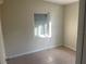 Small bedroom with a window and tile floors at 21921 Beverly Ave, Port Charlotte, FL 33952