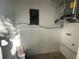 Unfinished mechanical/laundry room with AC unit and electrical panel at 21921 Beverly Ave, Port Charlotte, FL 33952