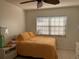 Bright bedroom with a double bed and white dresser at 23465 Harborview Rd # 1006, Punta Gorda, FL 33980