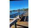 Wooden community boat dock with seating area at 23465 Harborview Rd # 1006, Punta Gorda, FL 33980