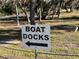 Sign indicating the direction to boat docks at 23465 Harborview Rd # 1006, Punta Gorda, FL 33980