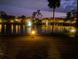 Scenic lake view at night with fountain at 23465 Harborview Rd # 1006, Punta Gorda, FL 33980