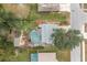 Bird's-eye view showing house, pool, and surrounding landscape at 238 Woodingham Trl, Venice, FL 34292