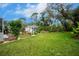 Expansive backyard with lush green lawn at 238 Woodingham Trl, Venice, FL 34292