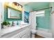 Spa-like bathroom with a light teal color scheme at 238 Woodingham Trl, Venice, FL 34292