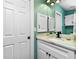 Modern bathroom with white cabinets and quartz countertop at 238 Woodingham Trl, Venice, FL 34292