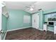 Serene bedroom featuring light walls, wood floors, and ample closet space at 238 Woodingham Trl, Venice, FL 34292