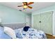 Guest bedroom featuring barn doors and wood flooring at 238 Woodingham Trl, Venice, FL 34292