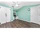 Light and airy bedroom with wood-look floors and built-in desk at 238 Woodingham Trl, Venice, FL 34292