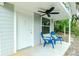 Charming front porch with blue chairs, ceiling fan at 238 Woodingham Trl, Venice, FL 34292