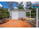 Detached garage with white door and ample space at 238 Woodingham Trl, Venice, FL 34292