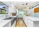 Modern kitchen with a farmhouse sink and quartz countertops at 238 Woodingham Trl, Venice, FL 34292