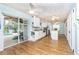 Bright kitchen with white cabinets, stainless steel appliances, and an island at 238 Woodingham Trl, Venice, FL 34292