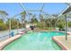 Inviting kidney-shaped pool with spa and screened enclosure at 238 Woodingham Trl, Venice, FL 34292