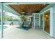 Inviting poolside patio with wooden ceiling and comfy seating at 238 Woodingham Trl, Venice, FL 34292