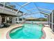 Enclosed kidney-shaped pool with spa and ample patio space at 238 Woodingham Trl, Venice, FL 34292