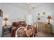 Bright bedroom featuring a metal bed frame and neutral decor at 24060 Buckingham Way, Punta Gorda, FL 33980