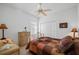 Cozy bedroom with a patterned comforter and built-in closet at 24060 Buckingham Way, Punta Gorda, FL 33980