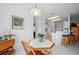 Bright dining area with octagonal table and wood chairs at 24060 Buckingham Way, Punta Gorda, FL 33980