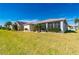 Well-maintained home with a large grassy yard at 24060 Buckingham Way, Punta Gorda, FL 33980