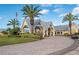 Community clubhouse entrance with landscaping at 24060 Buckingham Way, Punta Gorda, FL 33980