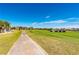 Golf course with paved pathway and golf carts at 24060 Buckingham Way, Punta Gorda, FL 33980