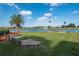 Horseshoe pit with lake view and fountain at 24060 Buckingham Way, Punta Gorda, FL 33980